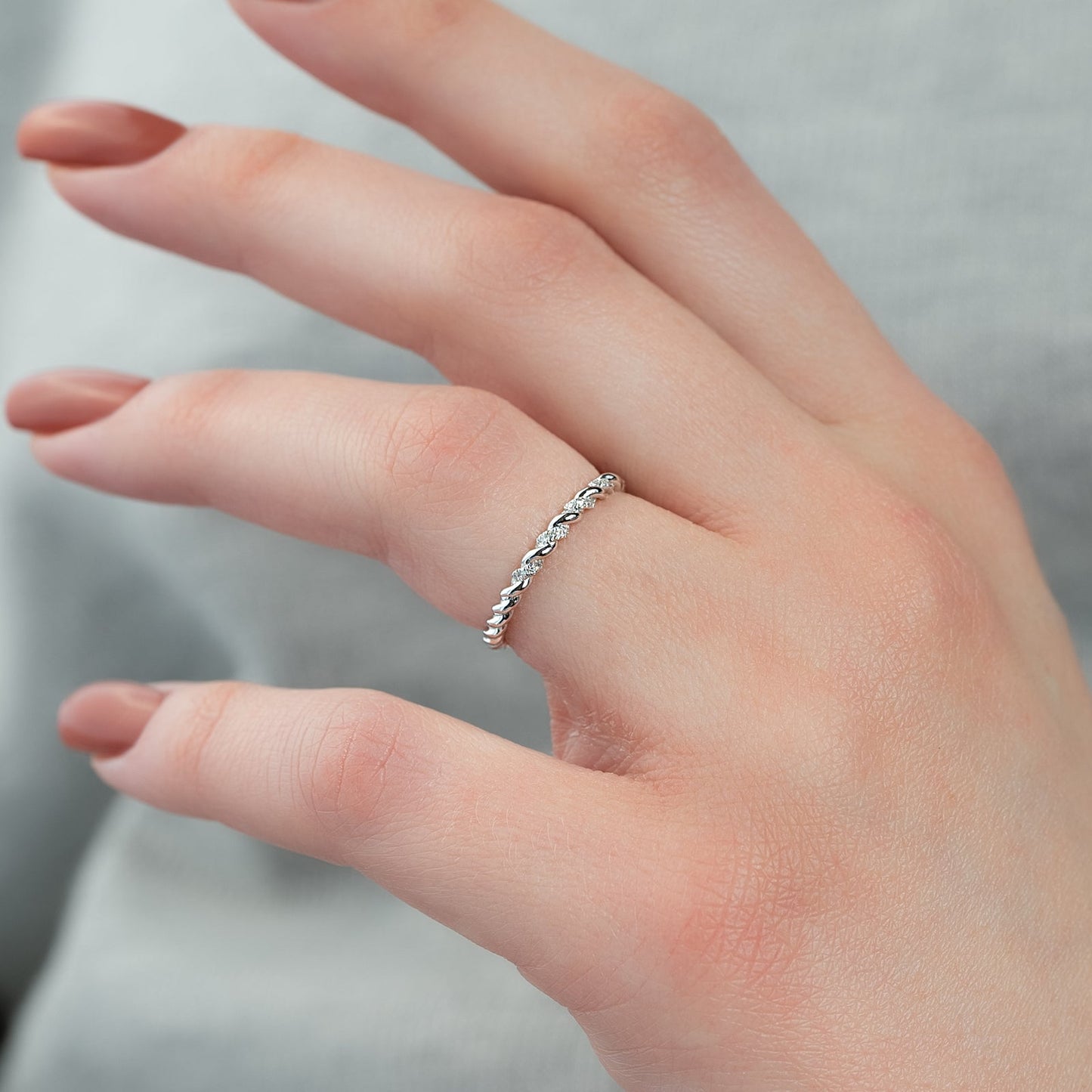 0.05 TCW Round Moissanite Twisted Wedding Band