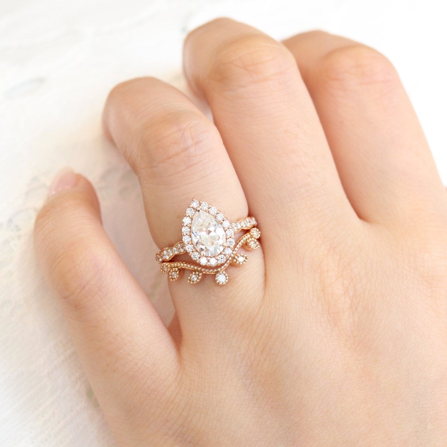 Pear Cut Moissanite Ring With curved leaf Diamond Band